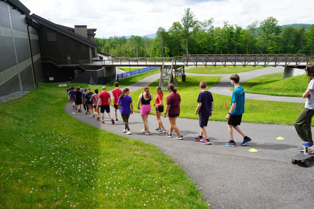 The candidate team does a track walk before wheels training.